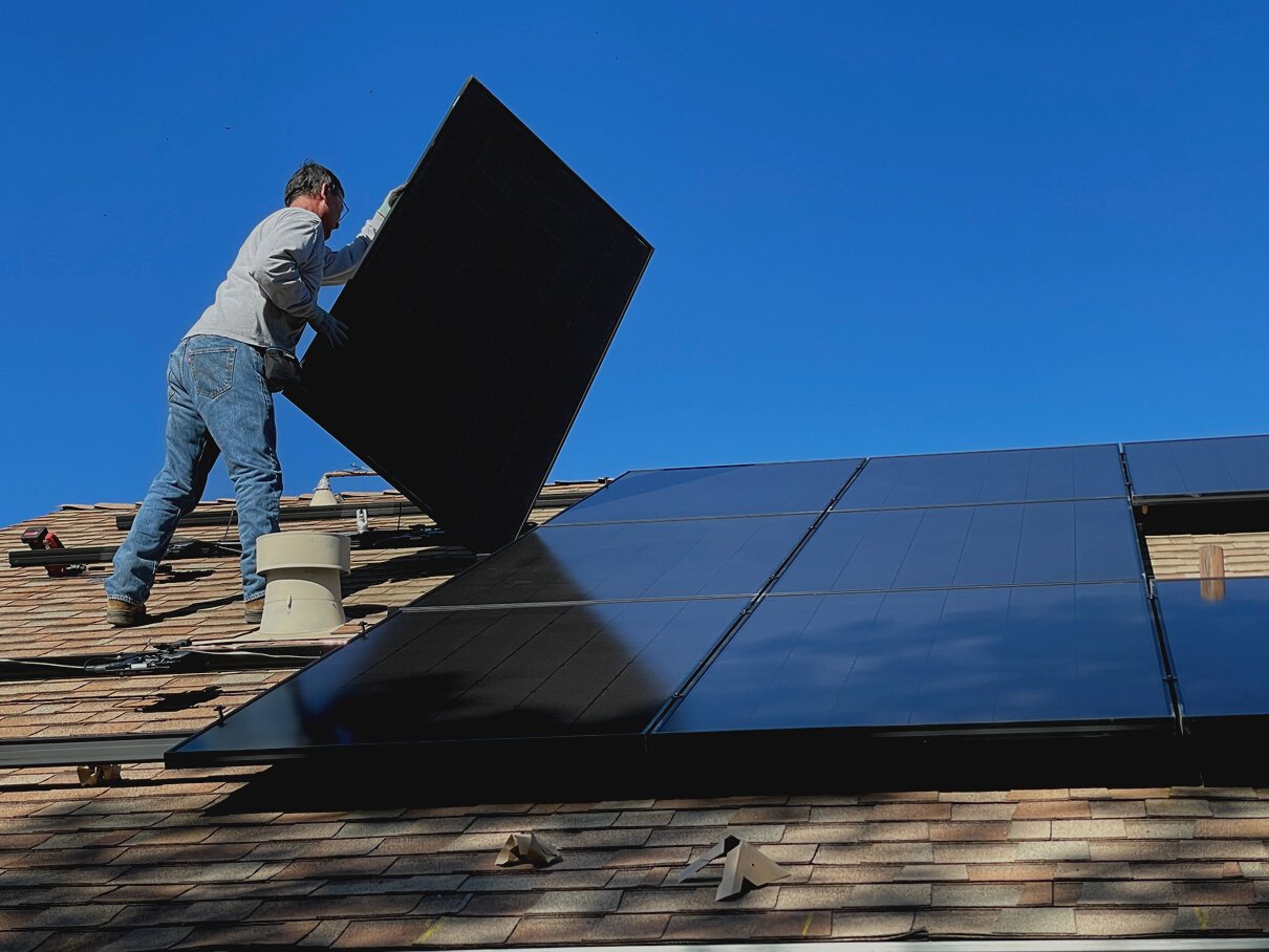 Man Installing Solar Panels 